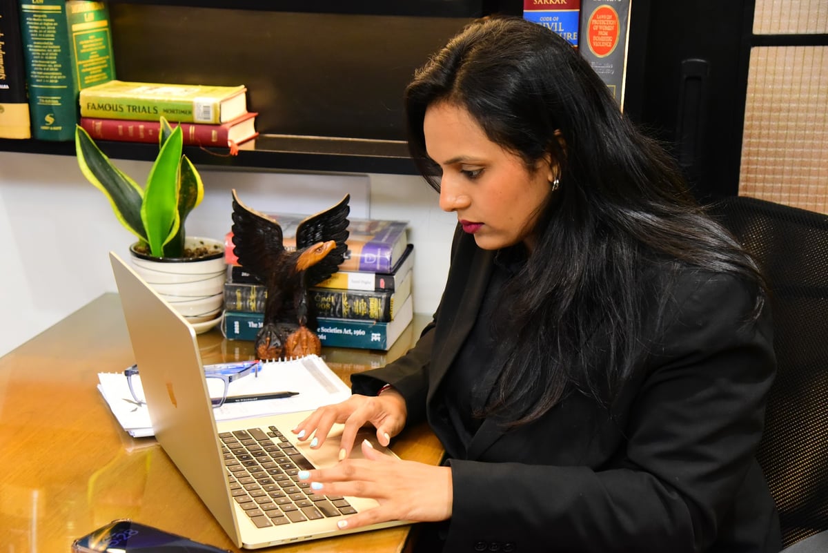 Adv. Labdhi Parekh working at her desk at Eagle Law & Integrity