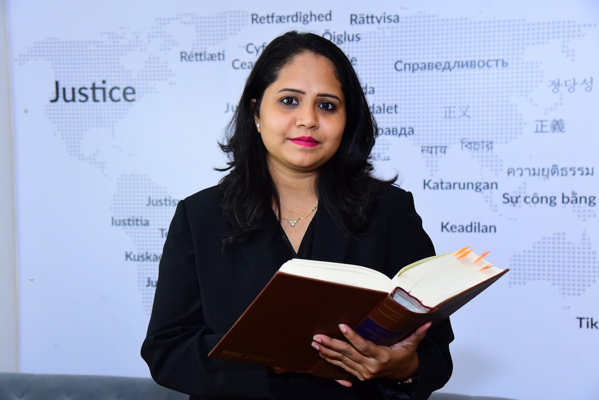 Adv. Sayali Borkar with a law book at Eagle Law & Integrity