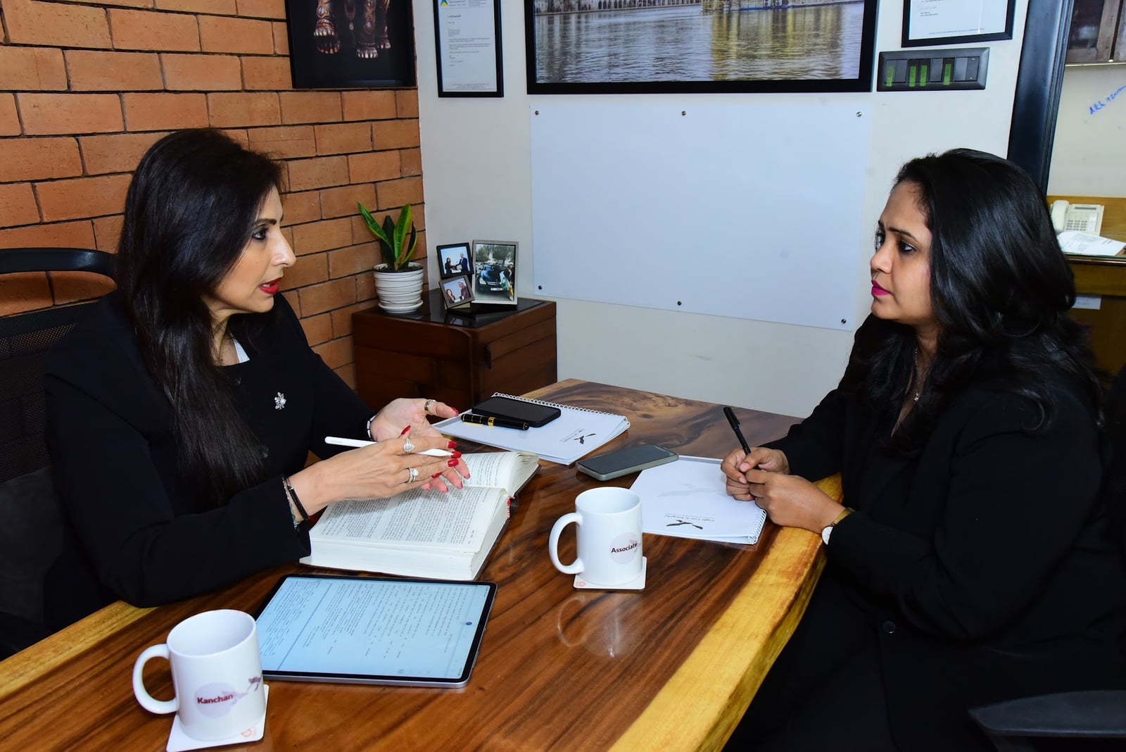 An advisor in careful discussion with a colleague at Eagle Law & Integrity