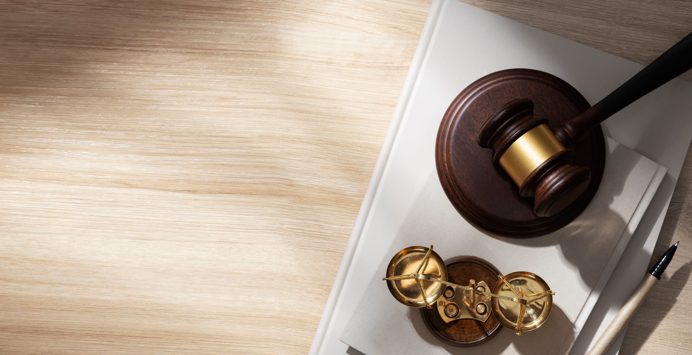 Gavel and scales of justice on a desk - Eagle Law & Integrity